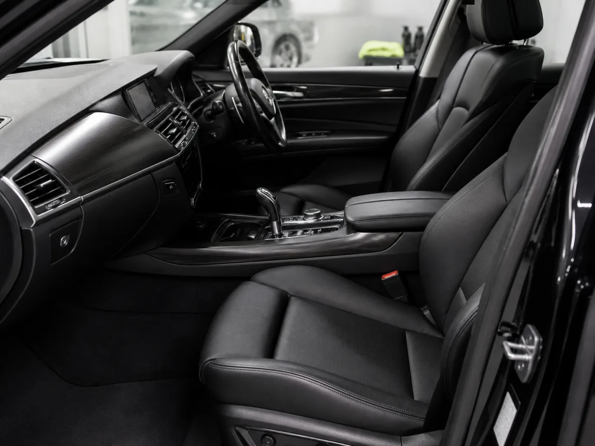 Spotless black leather car interior following a full valet